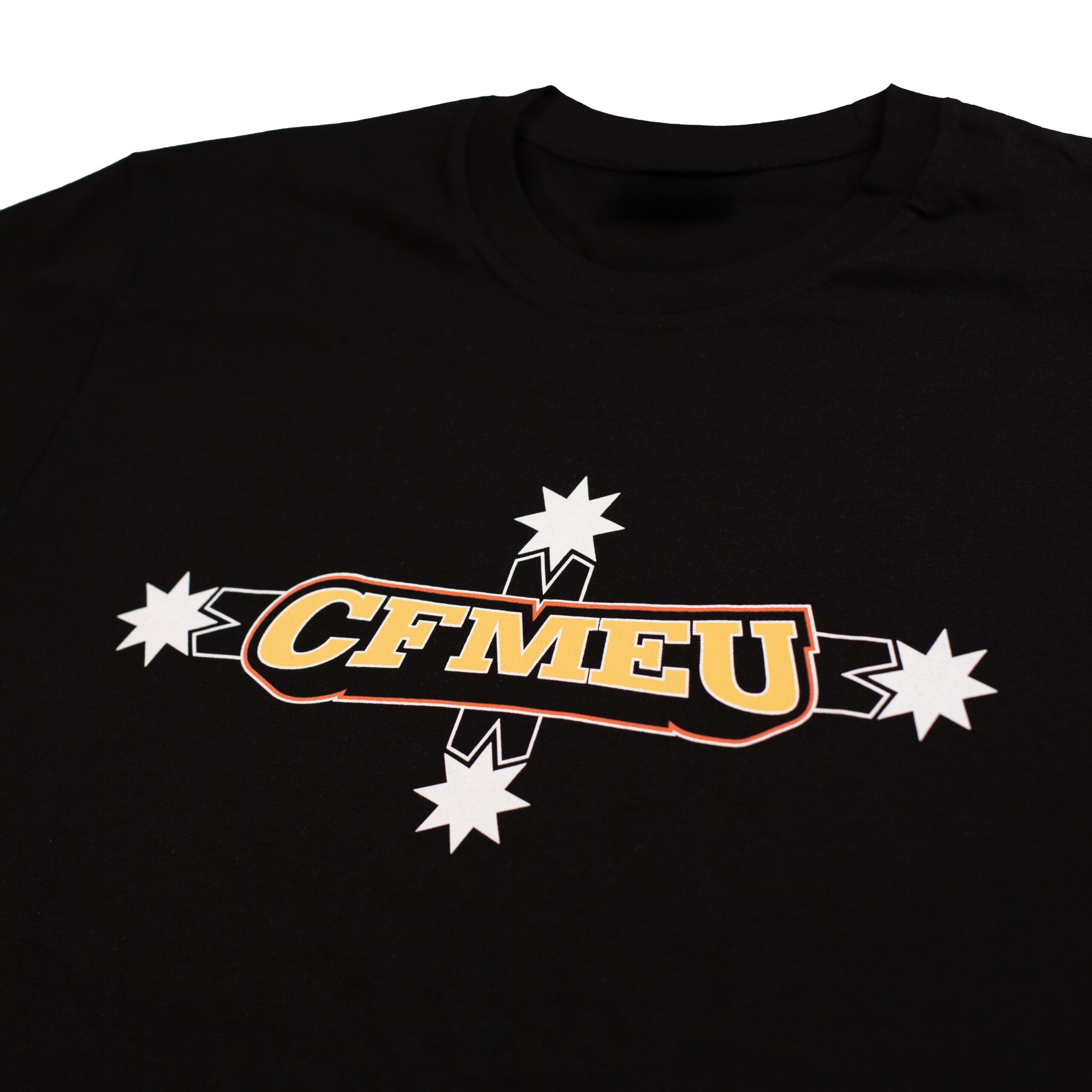 Black T-shirt with a bold graphic logo featuring white starburst shapes and orange-yellow outlined text (partial view of 'CENT...' brand)