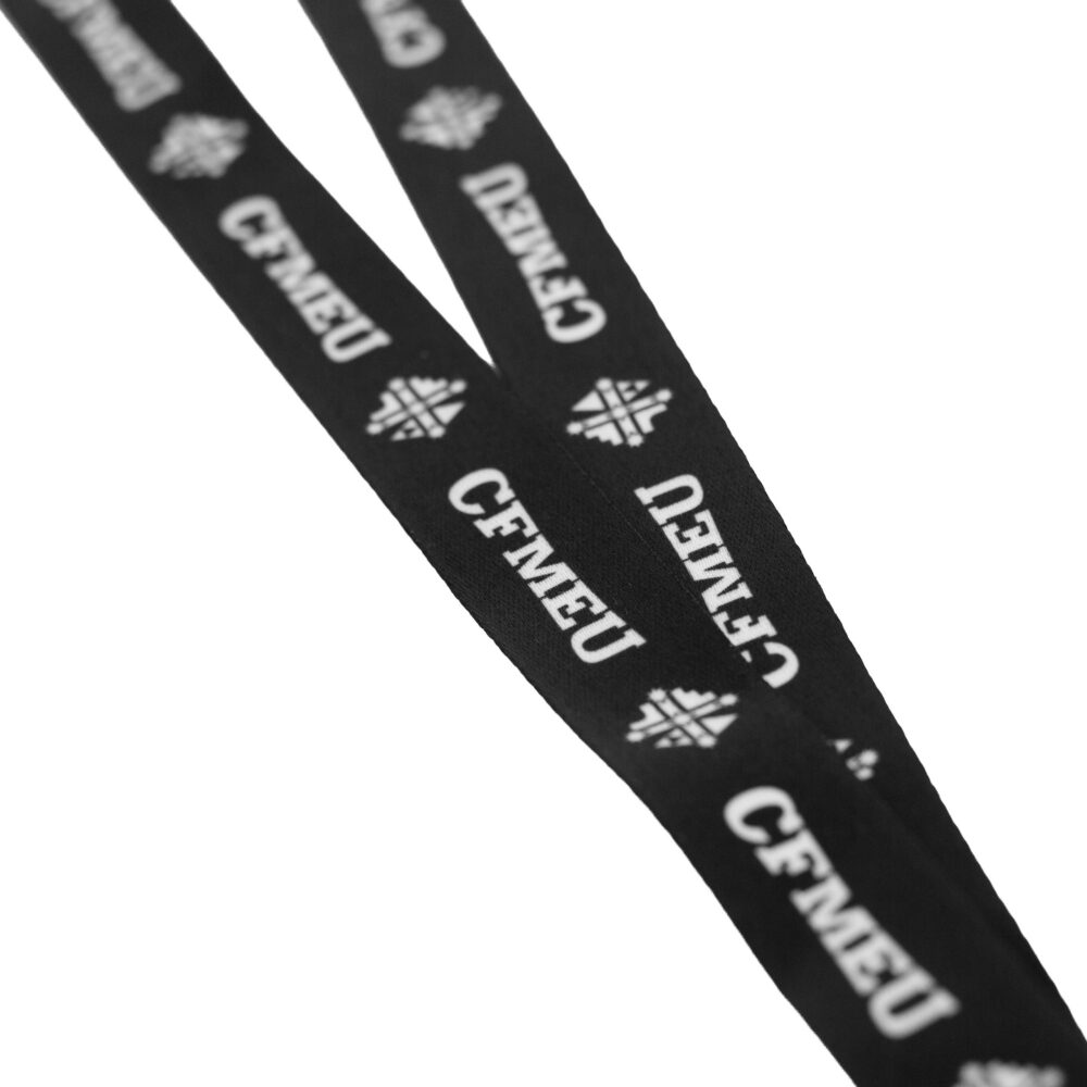 Two black fabric lanyards with white snowflake logos and partly legible white text, laid diagonally across a white background.