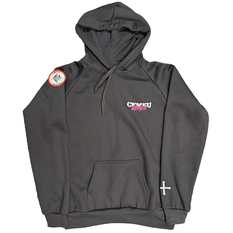 Black hoodie with front pocket and drawstrings, circular patch on the left shoulder, small cross on the right sleeve, and white-pink chest logo.