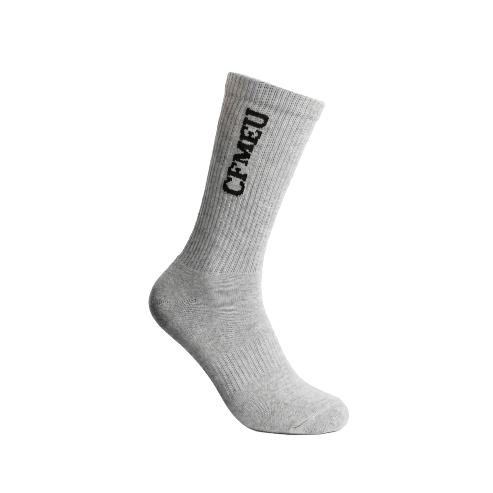 Grey knit sock displayed diagonally with the word GREY printed on the leg.